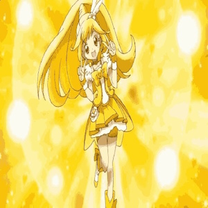 The fanmix's cover art. It shows Cure Peace from Smile Precure striking her transformation pose, and a filter has been applied to give it an 8-bit feeling.